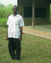 Jimmy in front of the school where he has been teaching (Ghana, Jan 2007)